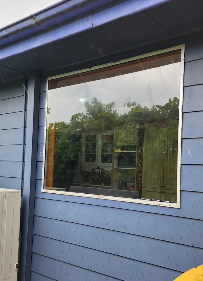 A Blue House With A Large Window On The Side — Lumba Glass & Glazing In Kincumber, NSW