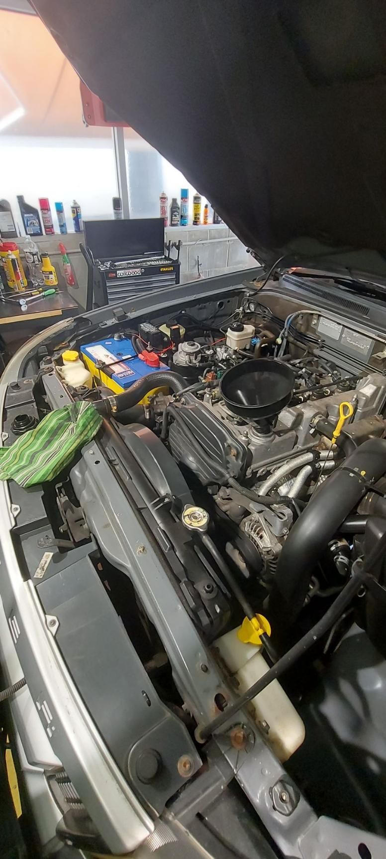 The Hood of A Car Is Open and The Engine Is Visible  — Coastal Mechanical Servicing and Repairs in Wurtulla, QLD