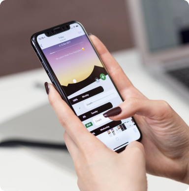 A person is holding a cell phone in their hand