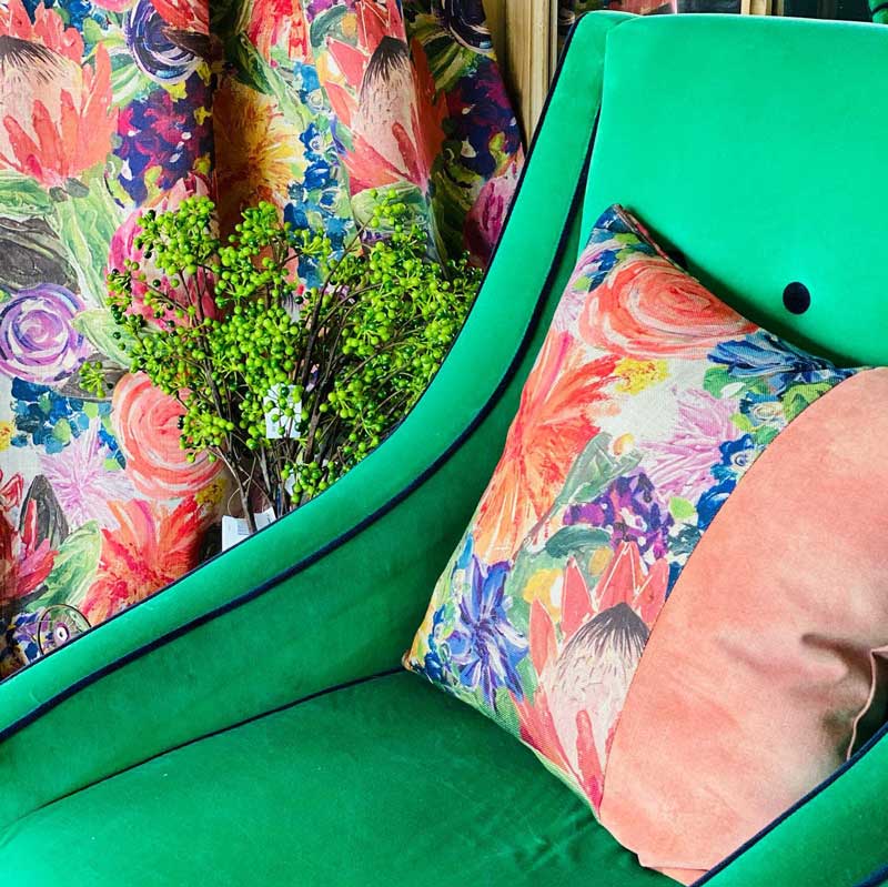 Green sofa with pink pillow — Tamworth Interiors in Tamworth, NSW 