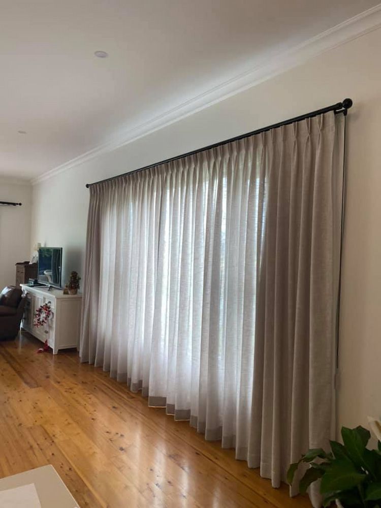 A Living Room With a Large Window and Curtains on It — Tamworth Interiors in Armidale, NSW 