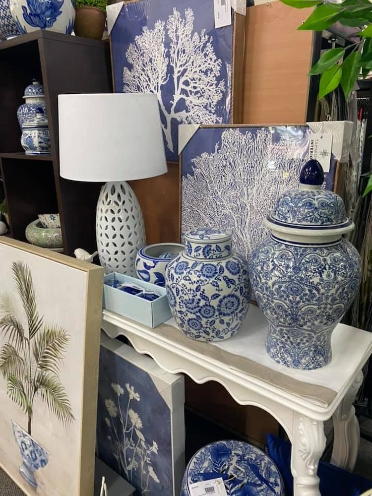 A Table Topped With Blue and White Vases and a Lamp — Tamworth Interiors in Armidale, NSW 