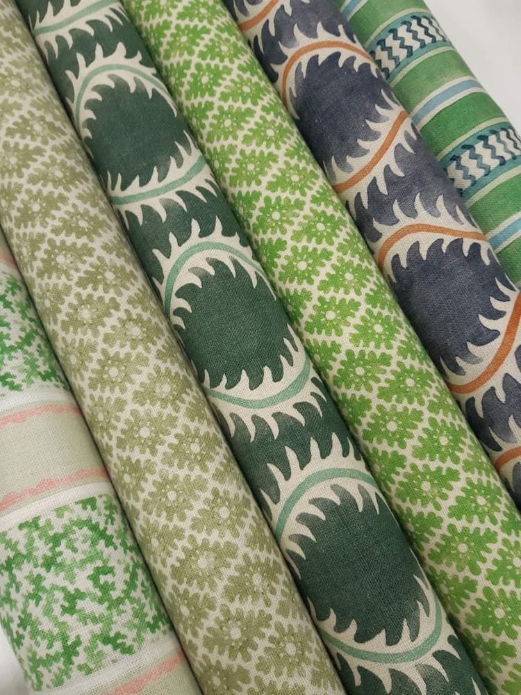 Four Rolls of Green Fabric With Different Patterns on Them — Tamworth Interiors in Armidale, NSW 