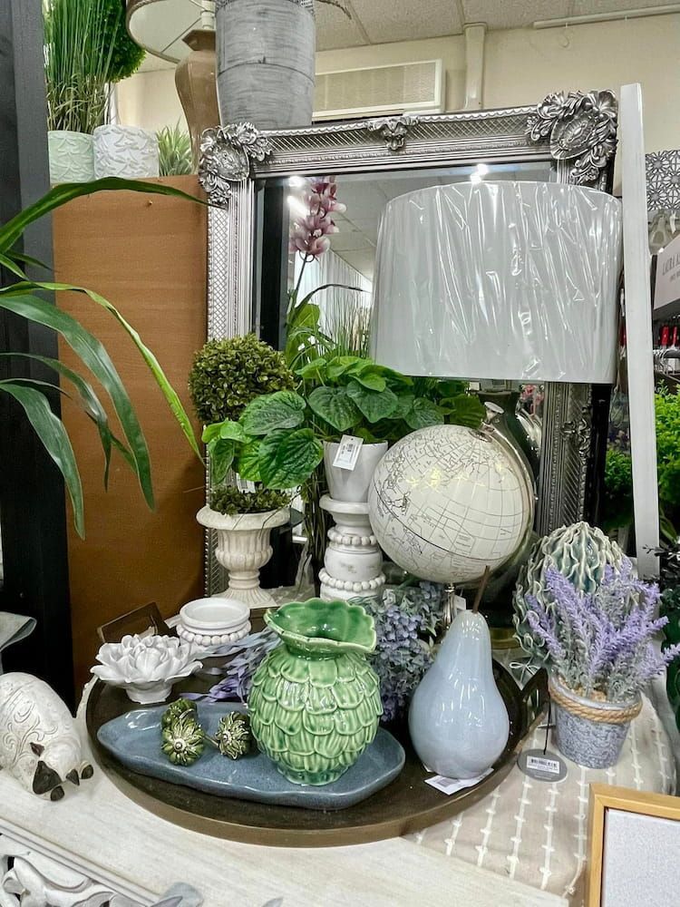 A Table Filled With Lots of Plants and Decorations — Tamworth Interiors in Armidale, NSW 
