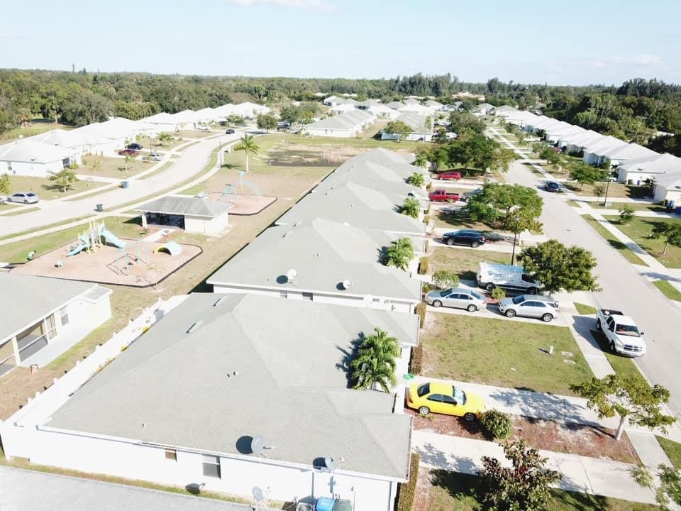 An aerial view of a residential area with lots of houses and trees.