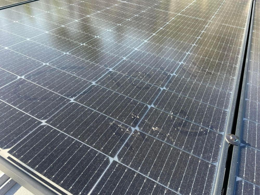 A close up of a solar panel on a roof.