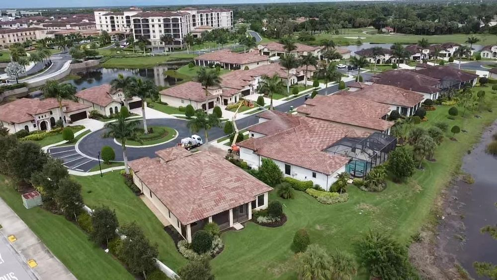 An aerial view of a residential area with lots of houses and trees.