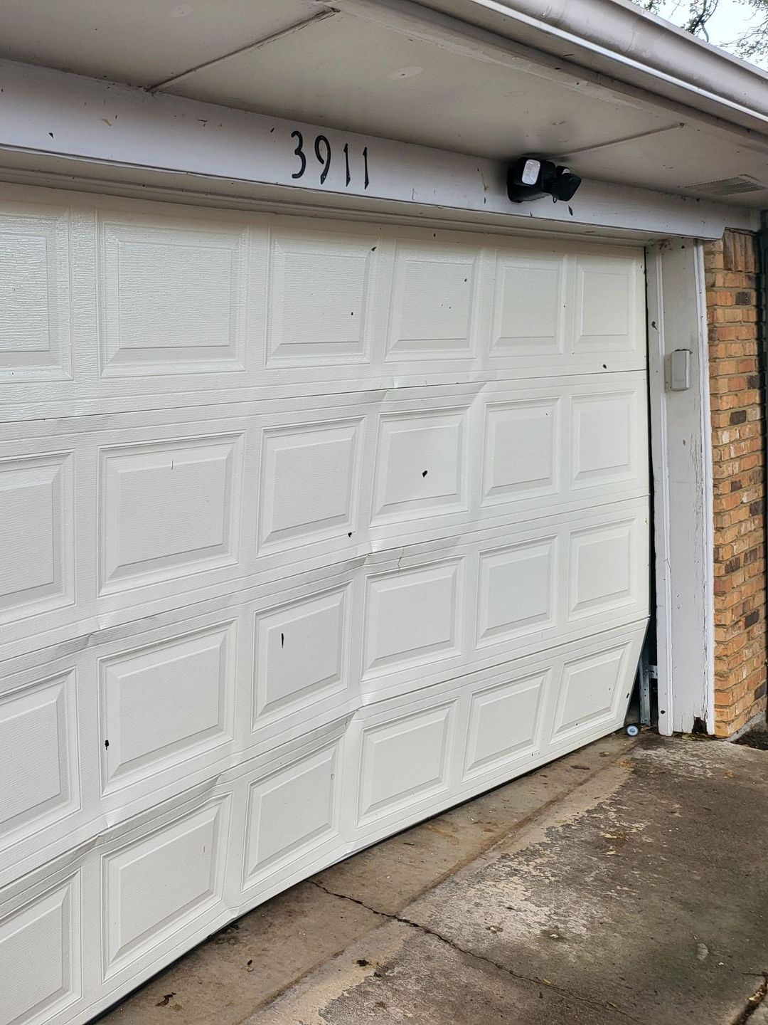 broken garage door in need of repair