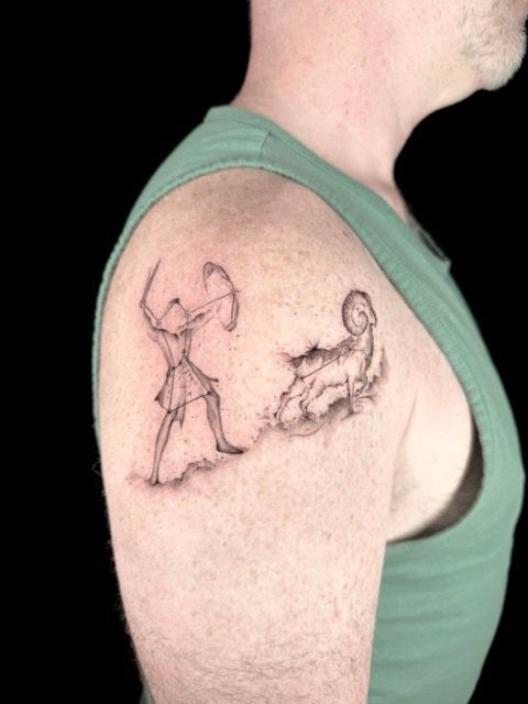 Fine-line illustrative tattoo on the upper arm