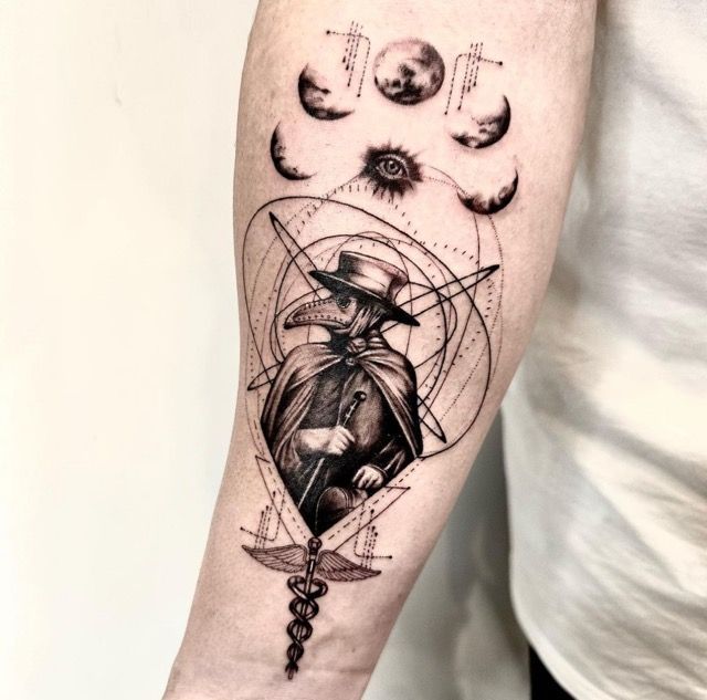 Black and white tattoo on arm: plague doctor with moon phases, crosses, eye, and medical symbol.