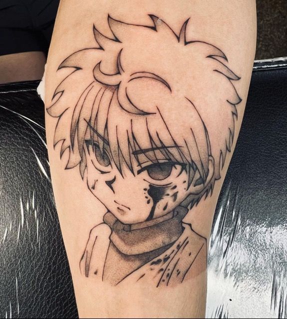 Tattoo of anime character Killua from Hunter x Hunter, with blood on his face.