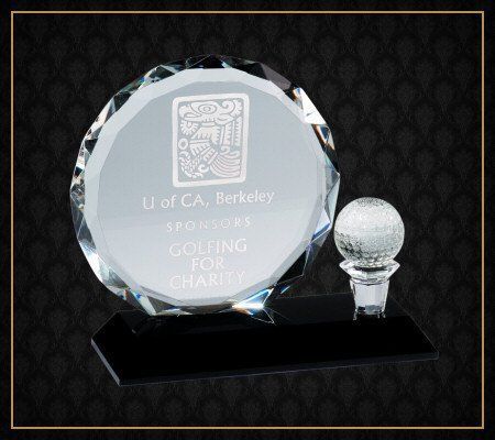 A glass plaque that says golfing for charity on it