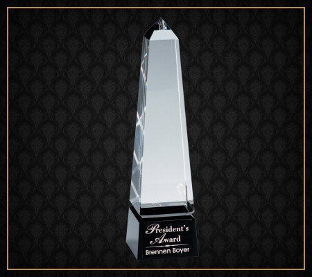 A glass trophy that says