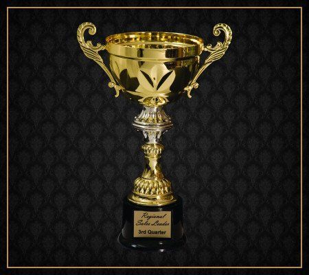 A gold trophy on a black background that says 2nd quarter