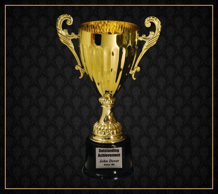 A gold trophy that says congratulations achievement on it