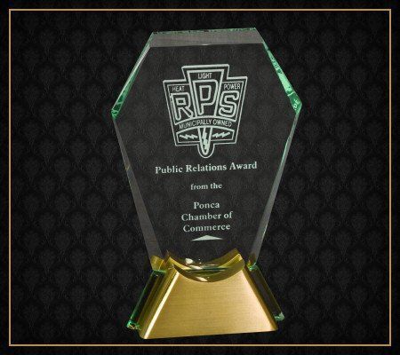A trophy that says public relations award on it