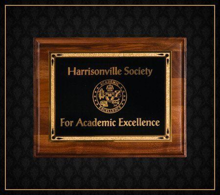 A framed plaque for the harrisonville society for academic excellence
