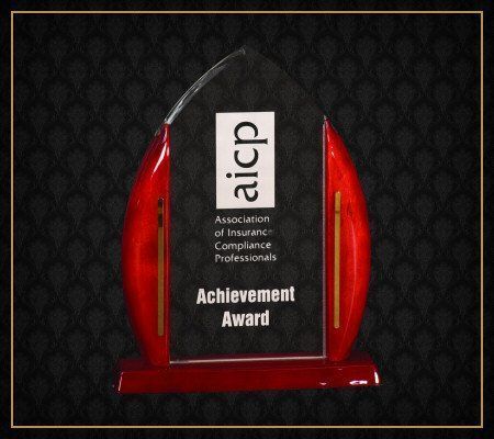 A plaque that says achievement award on it