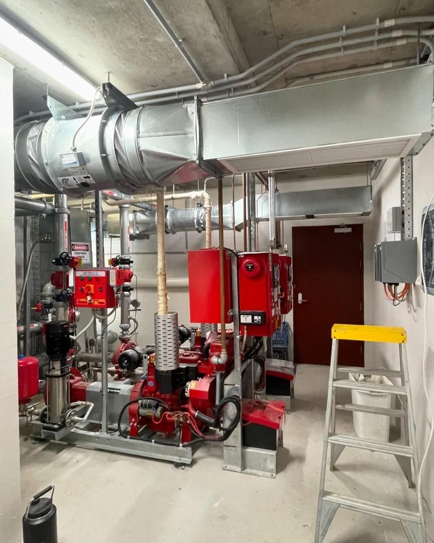 A Room with A Lot of Pipes and A Ladder in It — Staub Air in Garbutt, QLD