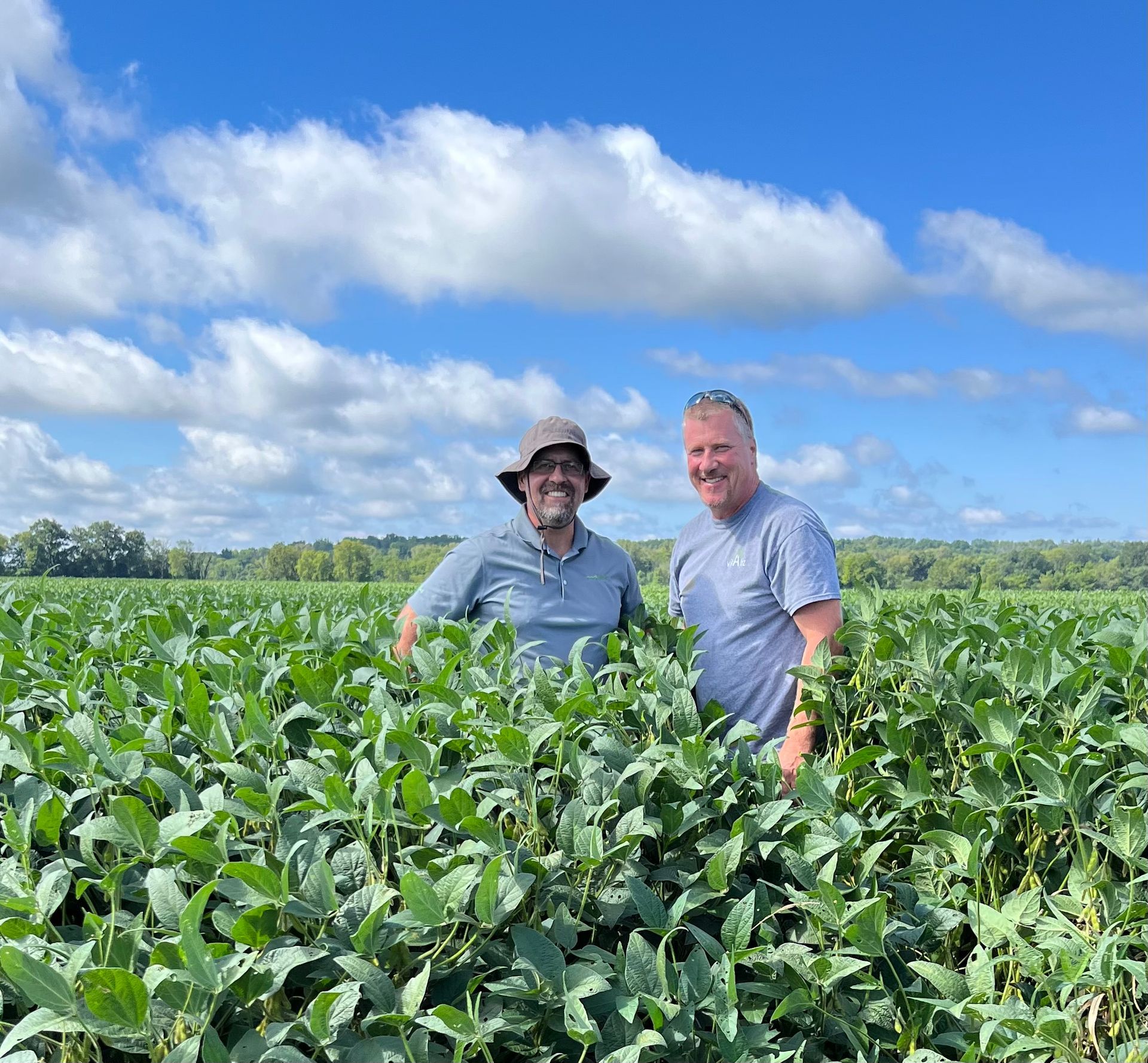 Ryan McAllister with a customer in the field.