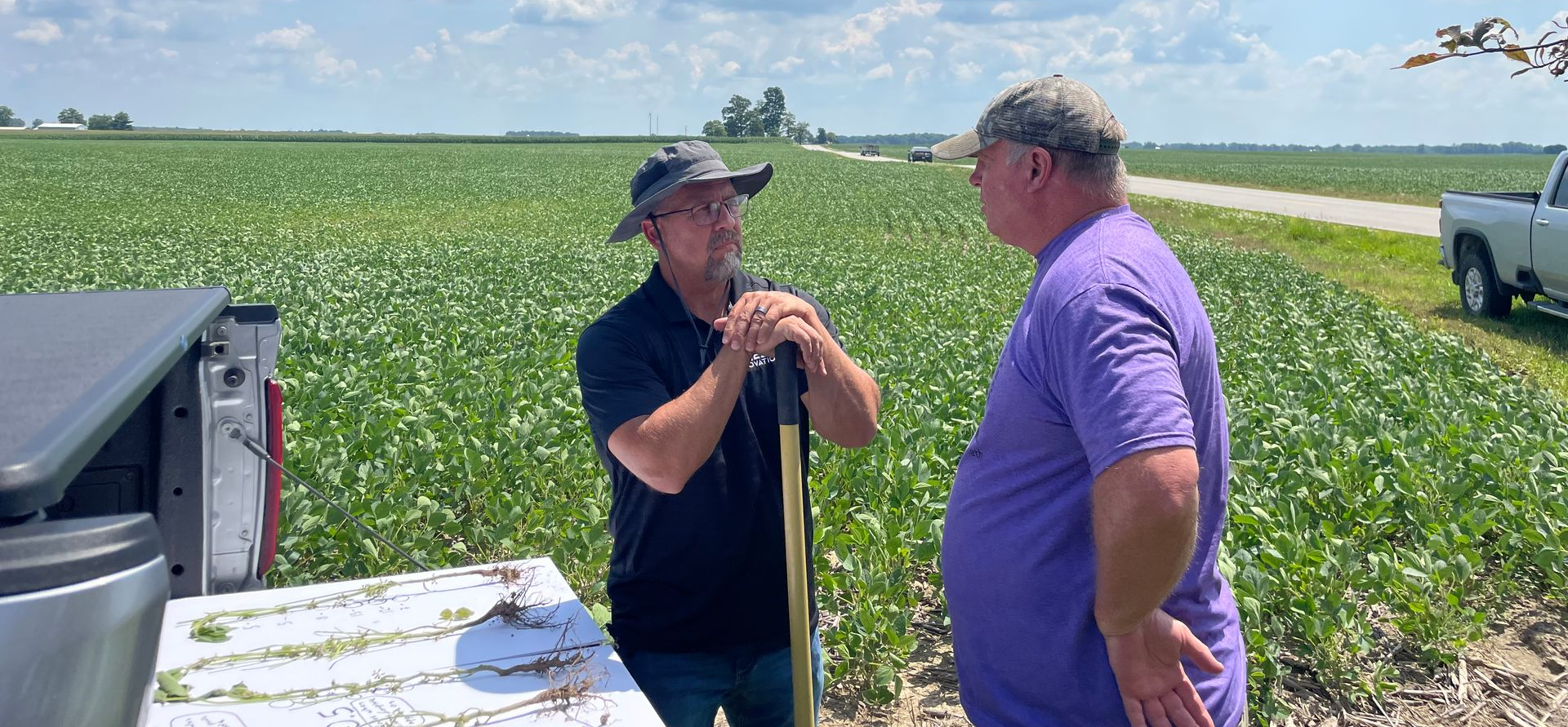Ryan McAllister discussing crop needs with customer.