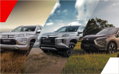 Três veículos Mitsubishi em um campo: SUV, caminhonete e crossover. Prata, cinza e marrom.