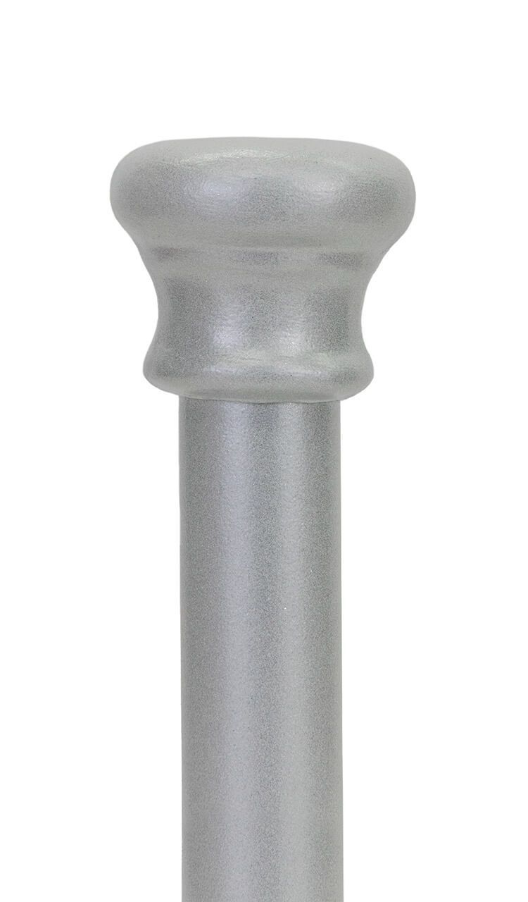 A close up of a metal pole with a round top on a white background.