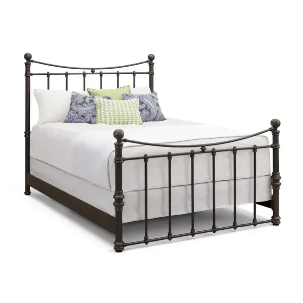 A bed with white sheets and pillows on it