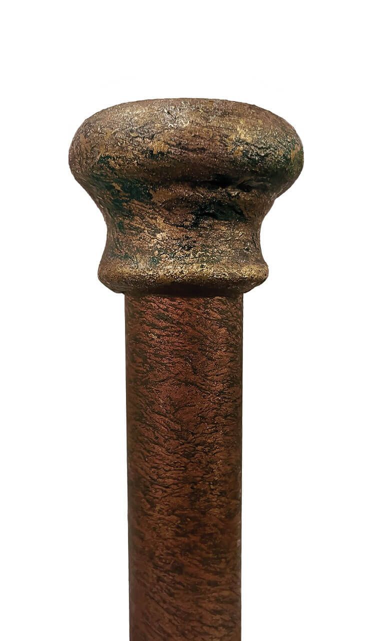A close up of a rusty metal pole on a white background.