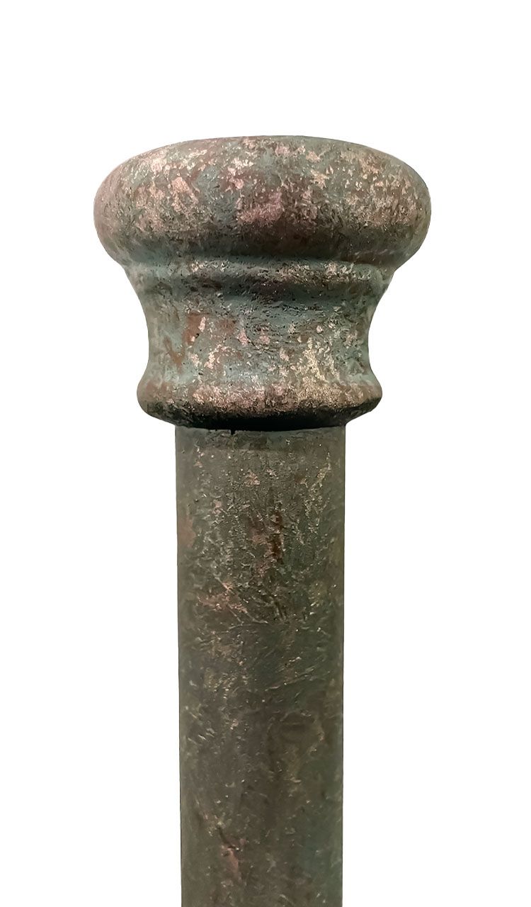 A close up of a rusty metal pole on a white background.