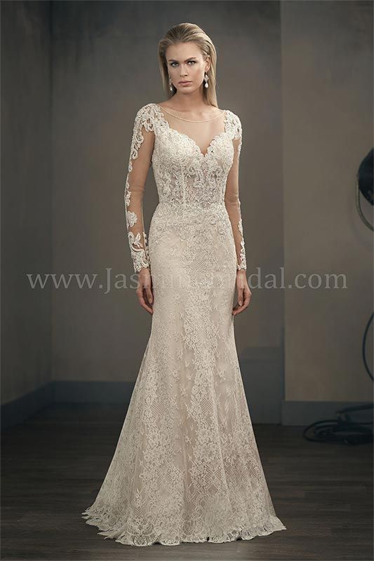 Floor-length ivory lace gown with long sleeves and a plunging neckline on a runway model