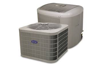 Two beige outdoor air conditioner units on a white background