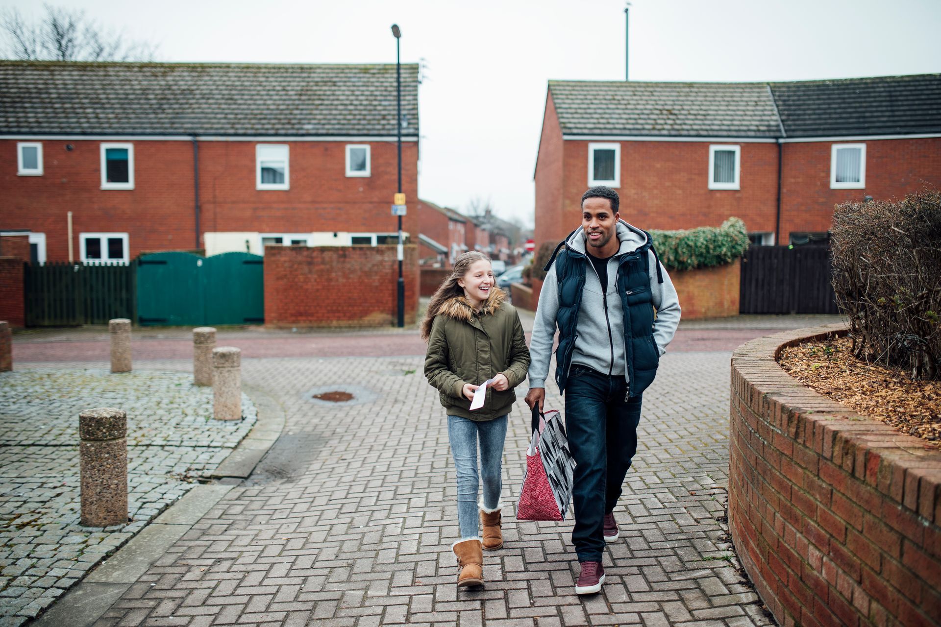 Residents walking through northeast housing estate