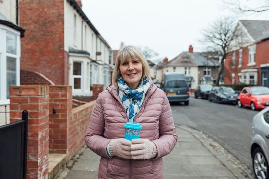 Resident standing on residential street in North East England