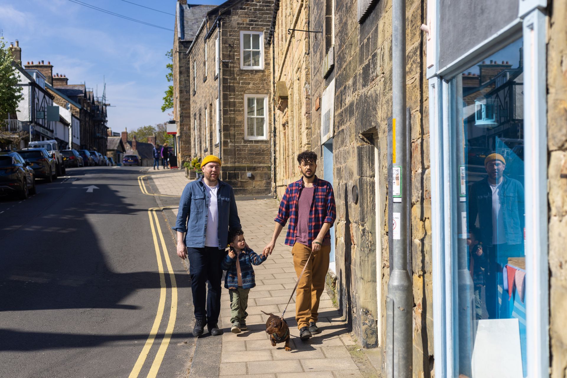 People walking along historic street in North East England