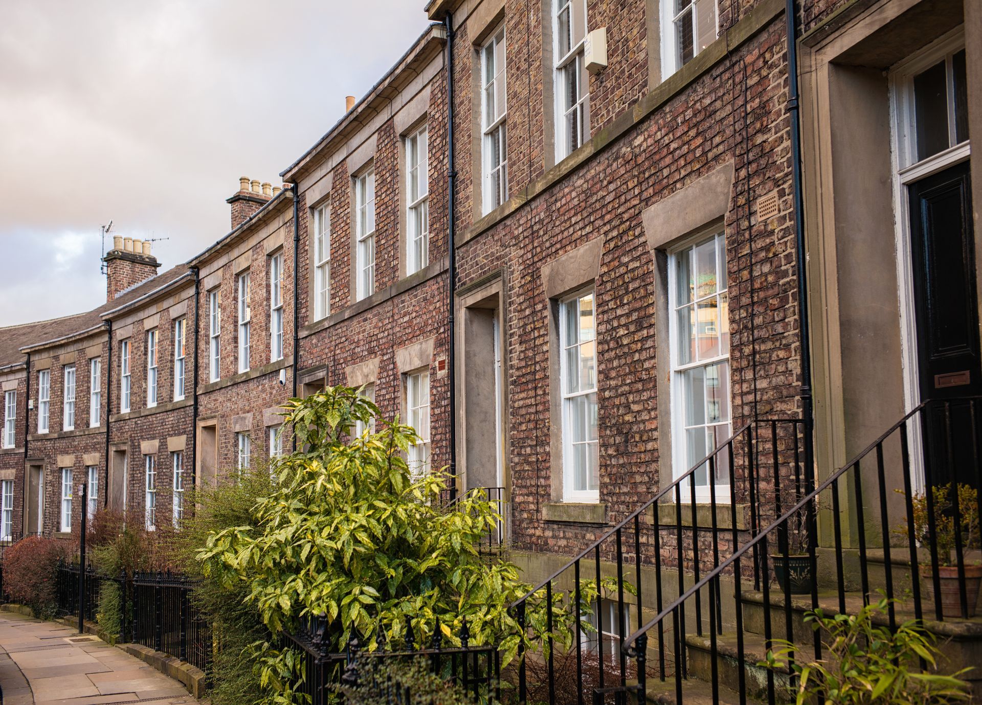 Traditional brick terraced St Thmoas Street in North East England