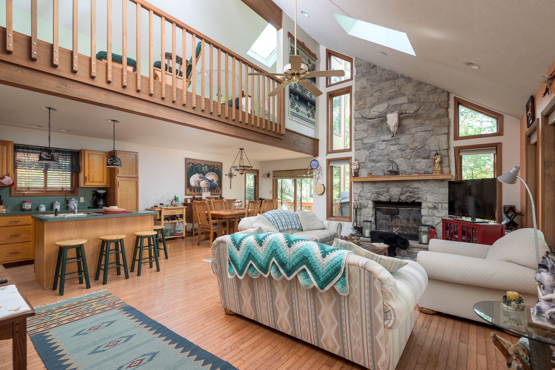 A living room filled with furniture and a fireplace in a house.