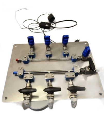 A metal panel mounted with a two-row manifold system featuring multiple blue-handled valves and black lever switches.
