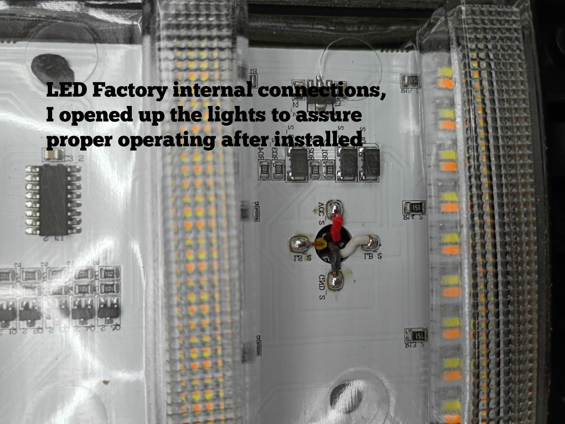 LED factory panel with many lights, a central exposed component, and overlaid repair text.