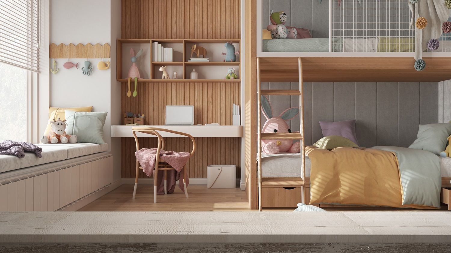 Cozy children's bunk room with desk, built-in shelves, pink chairs, and a bed with gold pillows