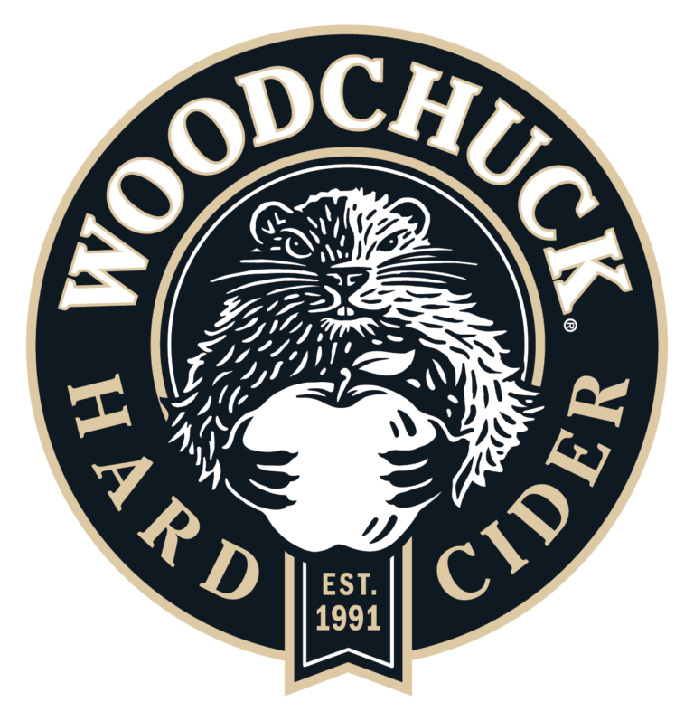 Woodchuck Hard Cider circular logo with a stylized woodchuck and “EST. 1991” text