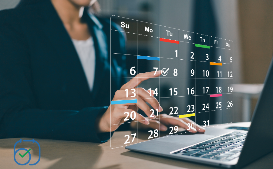 Transparent digital calendar over laptop and person working, with dates highlighted in blue and orange.