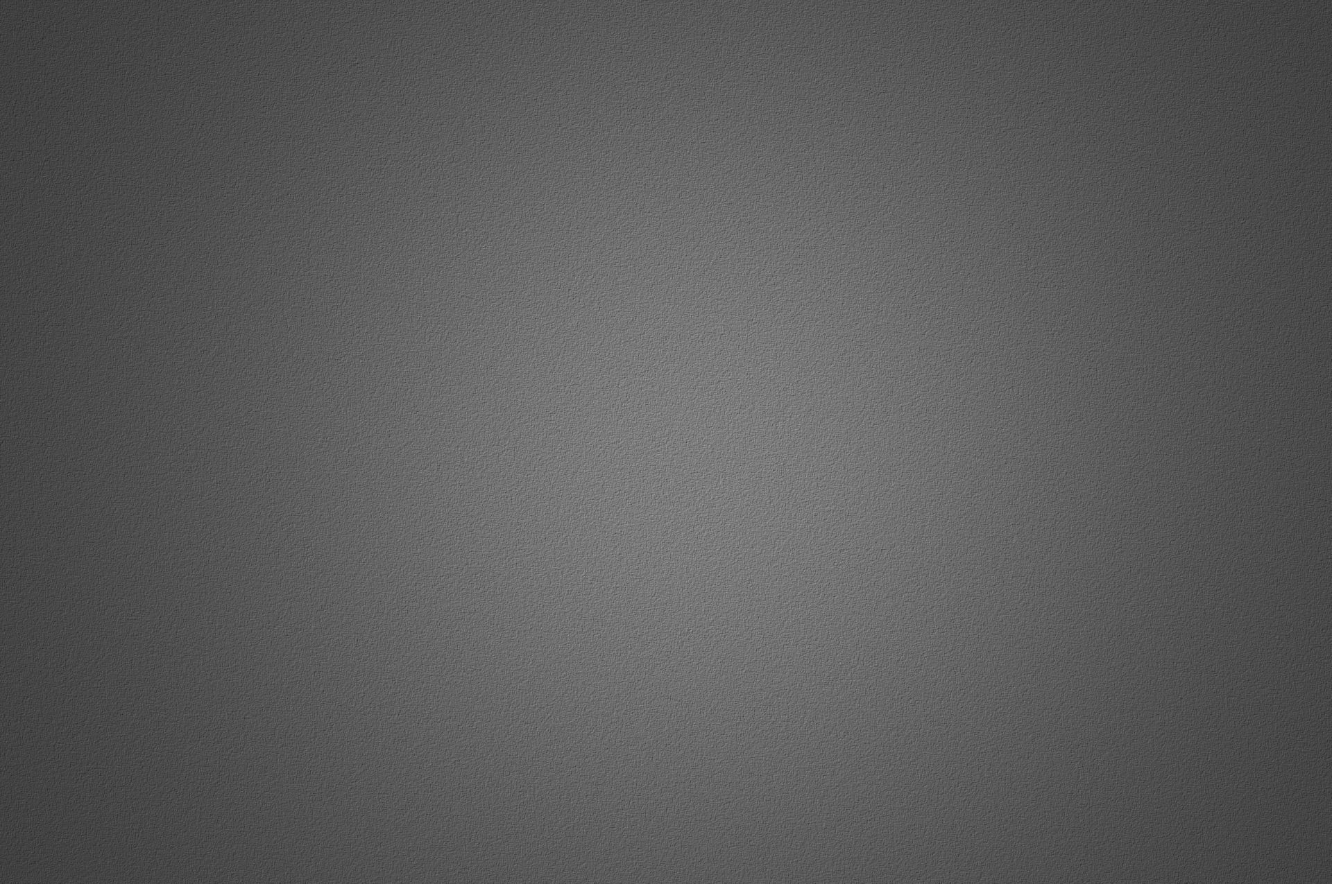 A close up of a gray background with a grainy texture.
