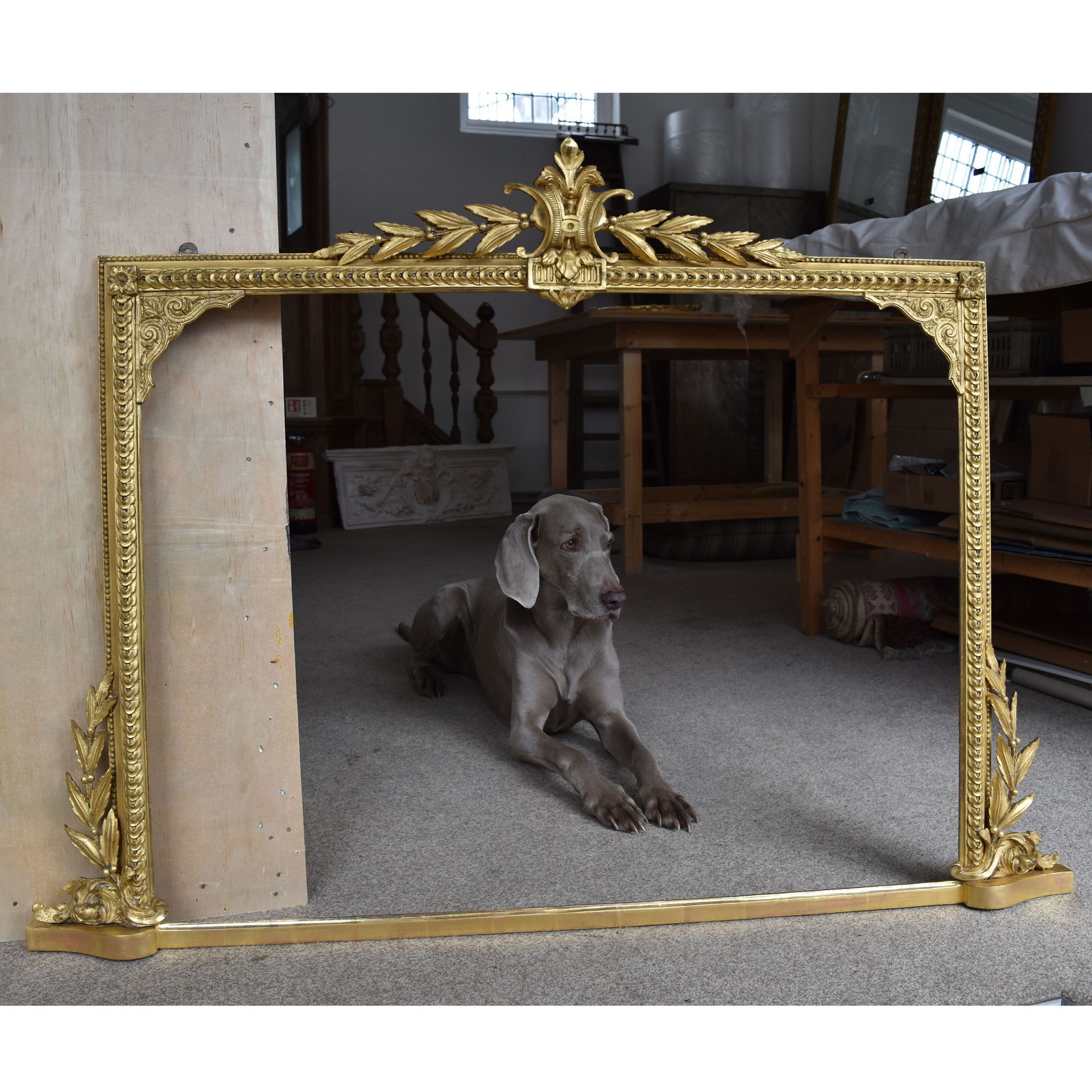 Over mantle mirror with bay leaves