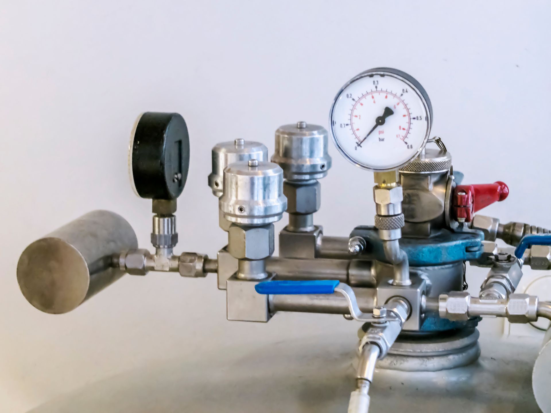 A close up of a pressure gauge on a machine