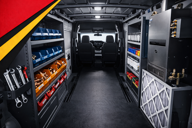 Organized van interior with shelves, tools, storage bins, and a clear central aisle to the front seats