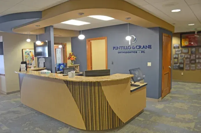 Reception desk and practice logo at Puntillo & Crane Orthodontics in Valparaiso, Indiana