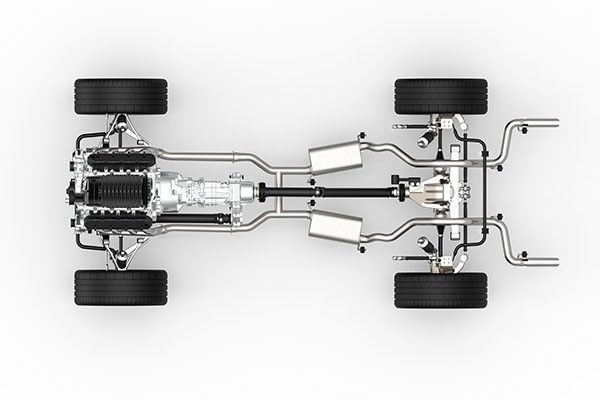 Top-down view of a car chassis with engine, transmission, suspension, exhaust, and wheels. | Morin Brothers Automotive