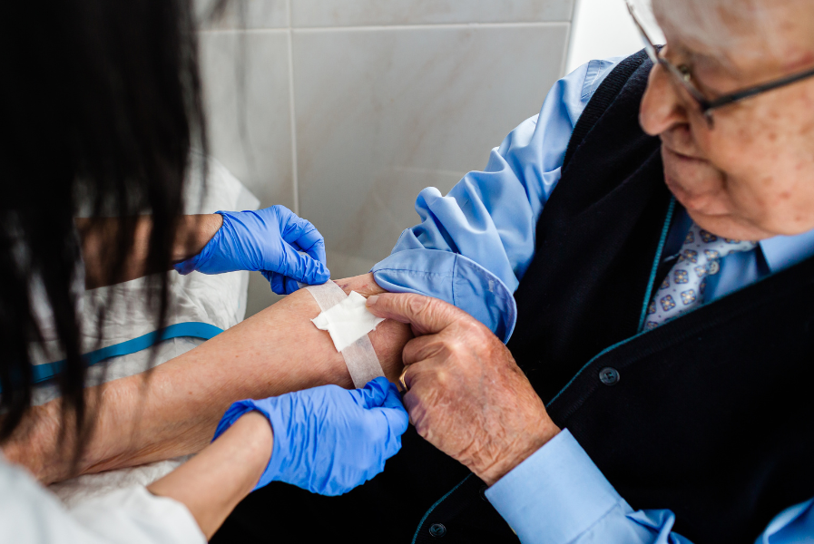 A senior citizen receiving mobile phlebotomy services