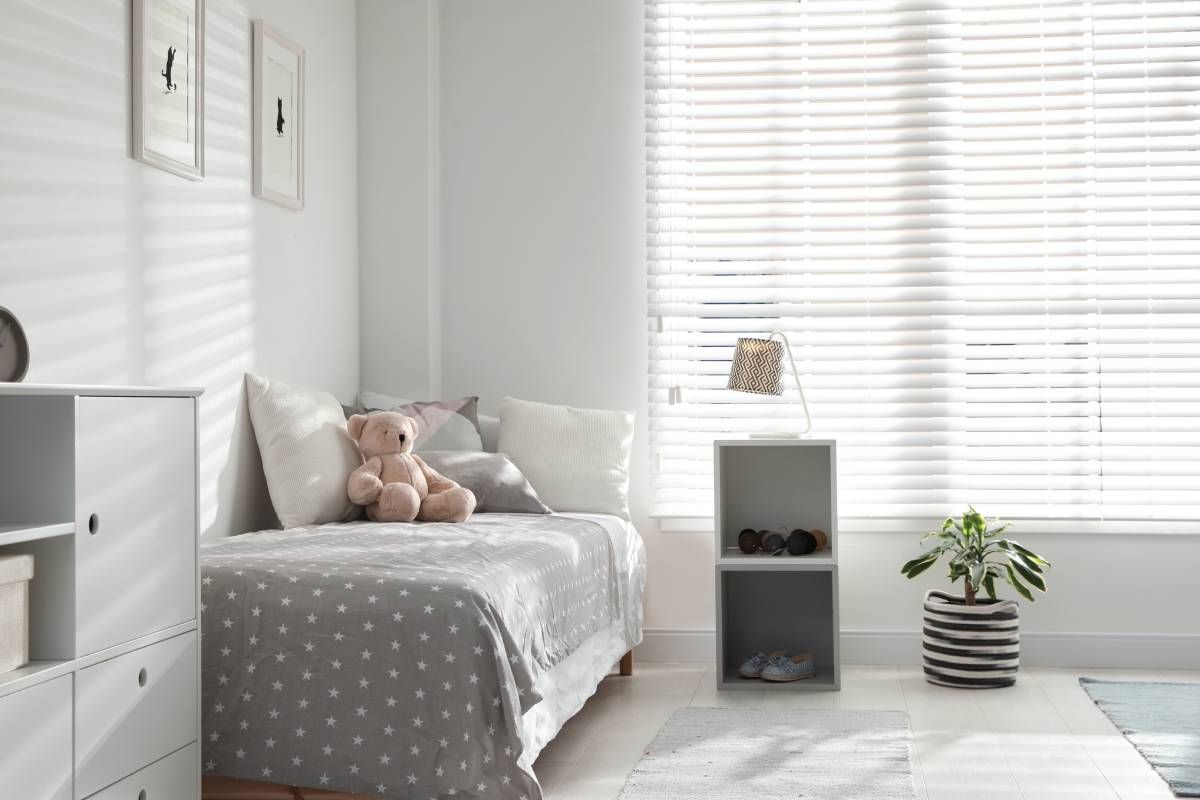 Kids blinds filtering light in a child’s bedroom during the day near New Hampshire
